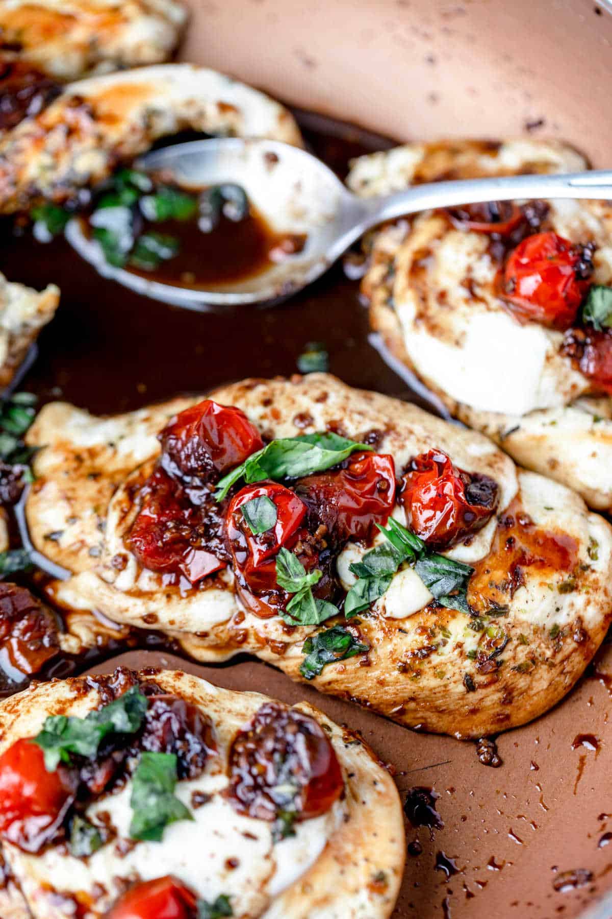 Caprese chicken in a copper skillet.