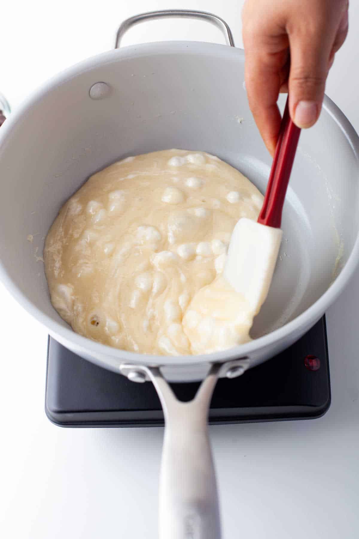 Butter and marshmallows melting in a saucepan.