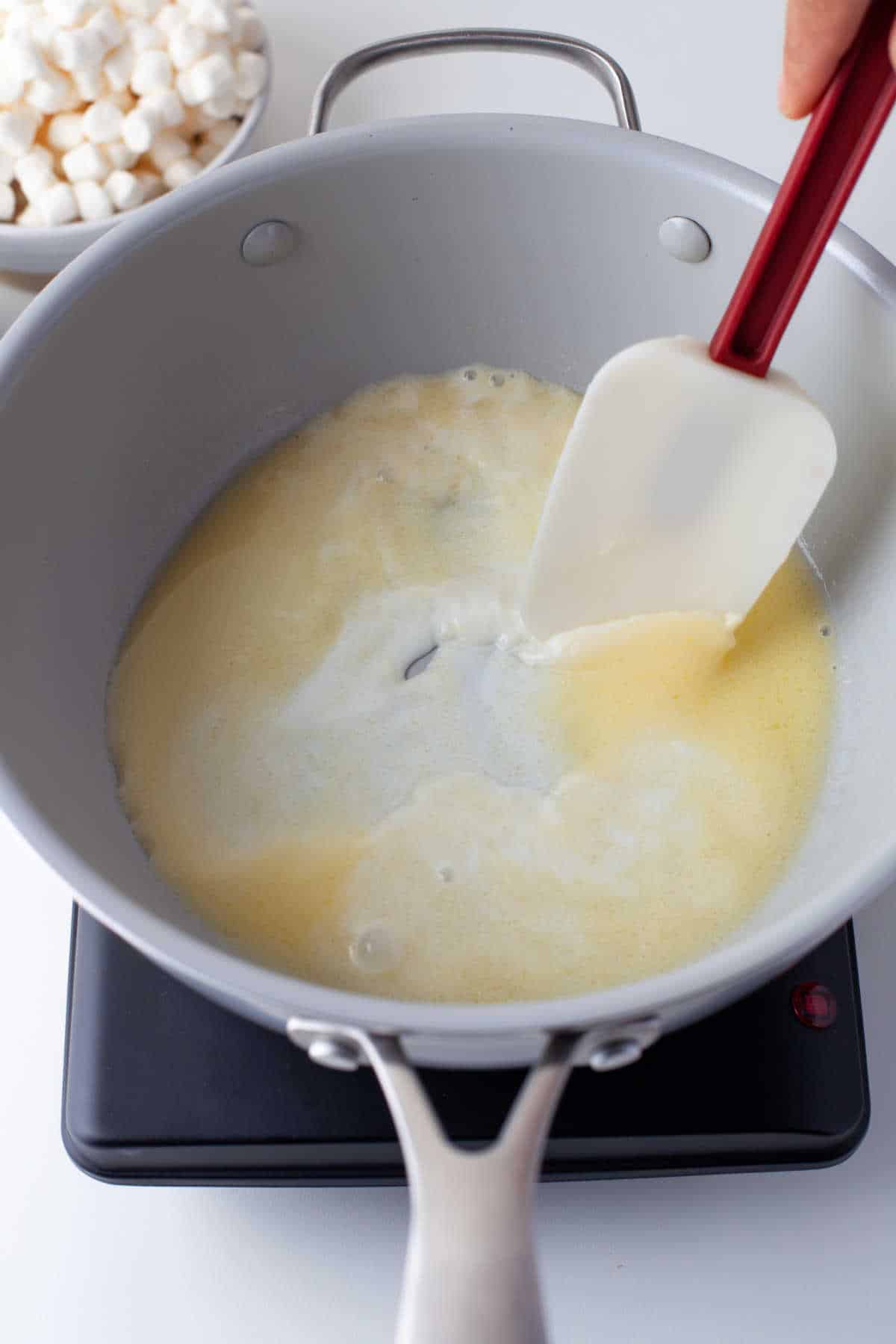 Butter melting in a saucepan.