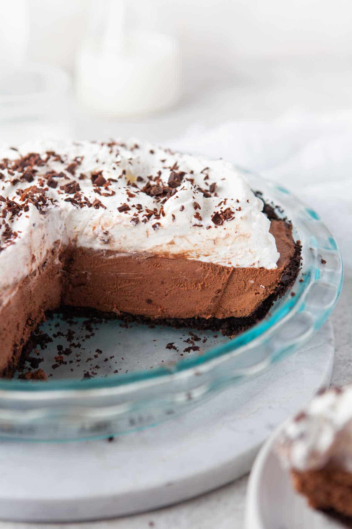 A no bake chocolate pie with two pieces missing.