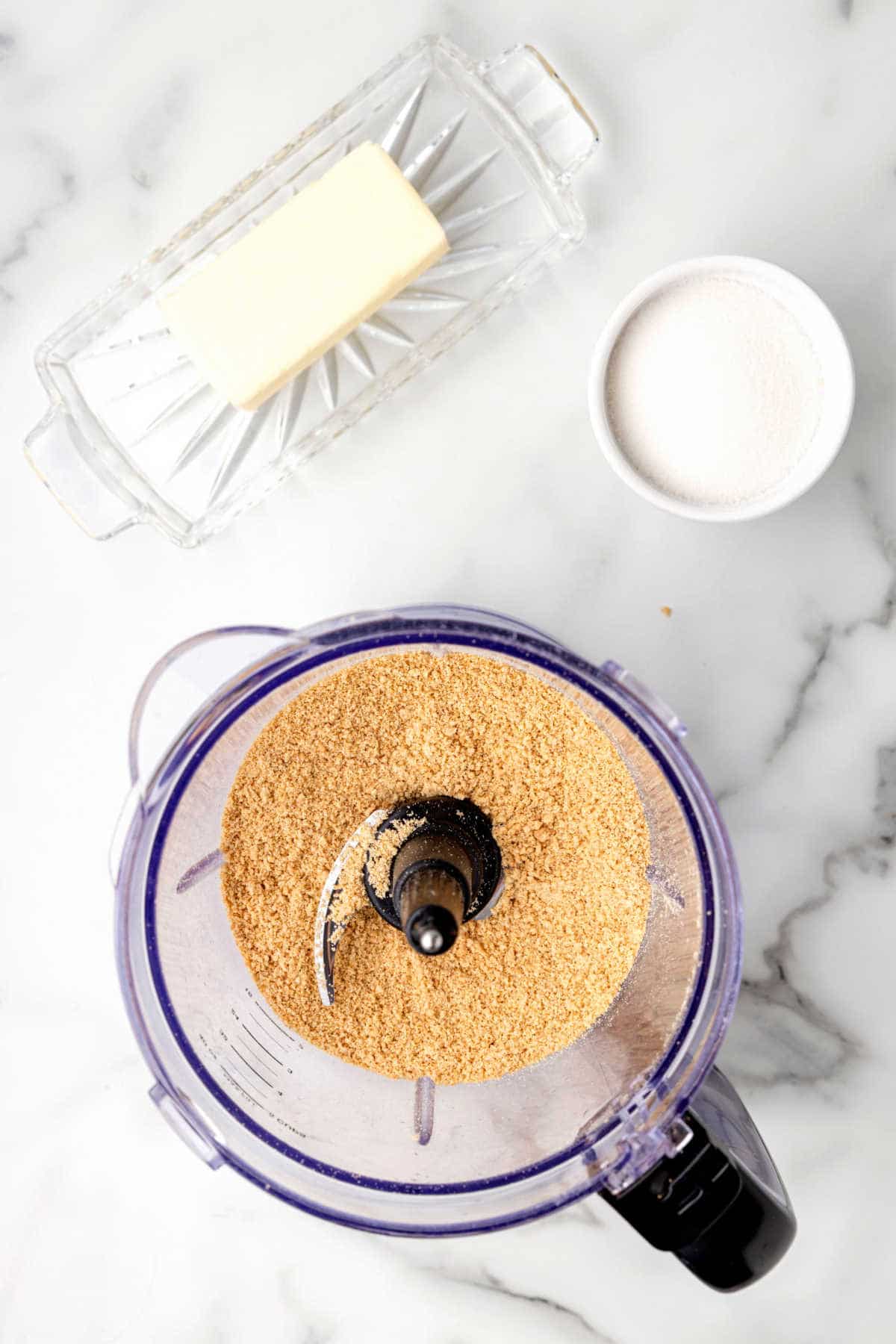 Graham cracker crumbs in a food processor.