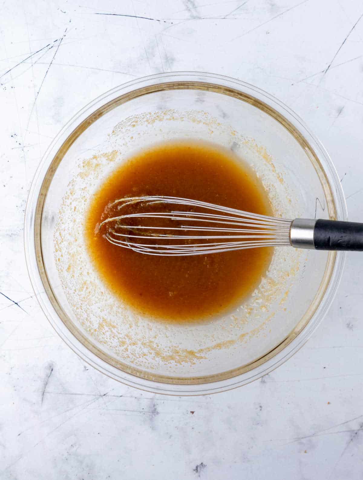 Sugars mixed into melted butter.