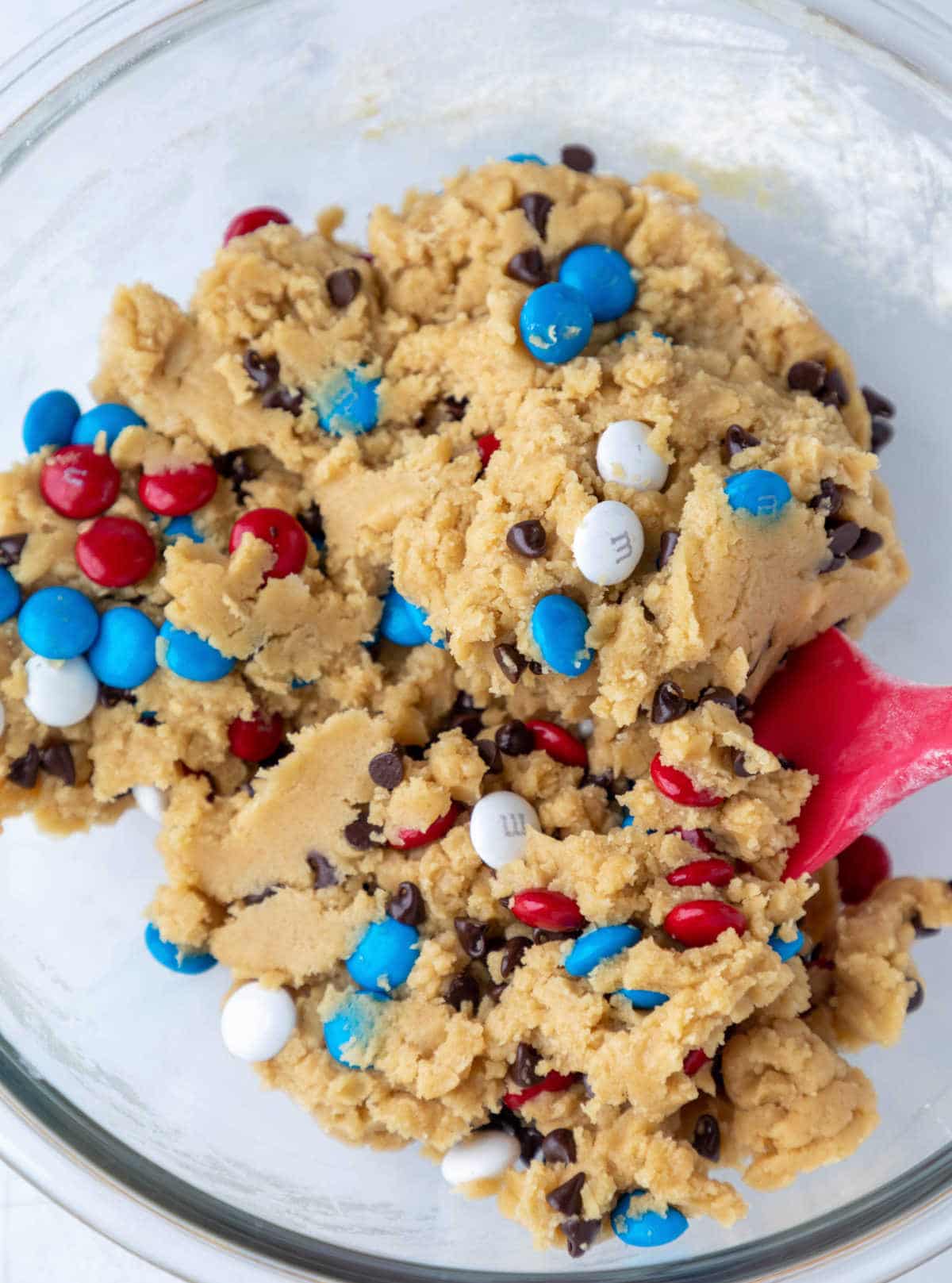 Cookie dough with M&Ms and mini chocolate chips in it.