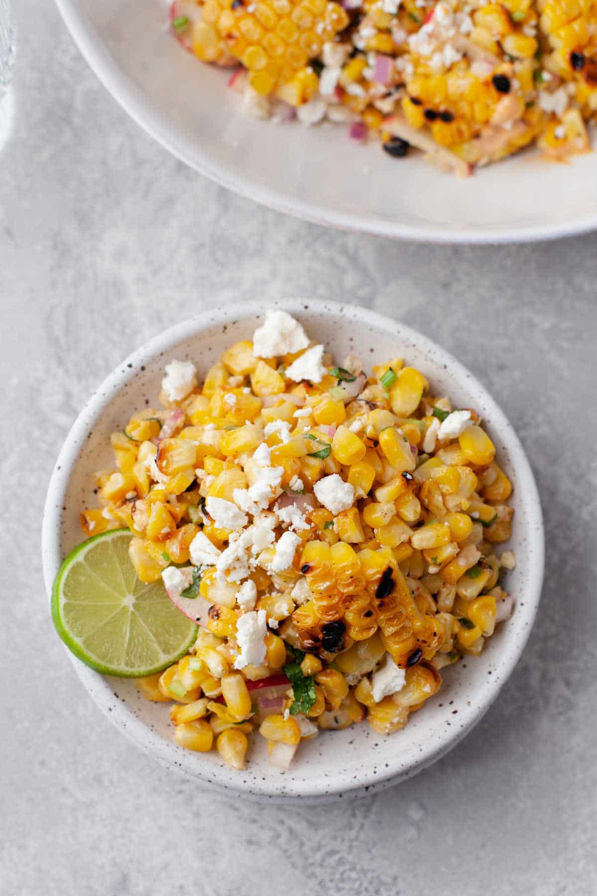 A plate of elote salad on a white plate. 