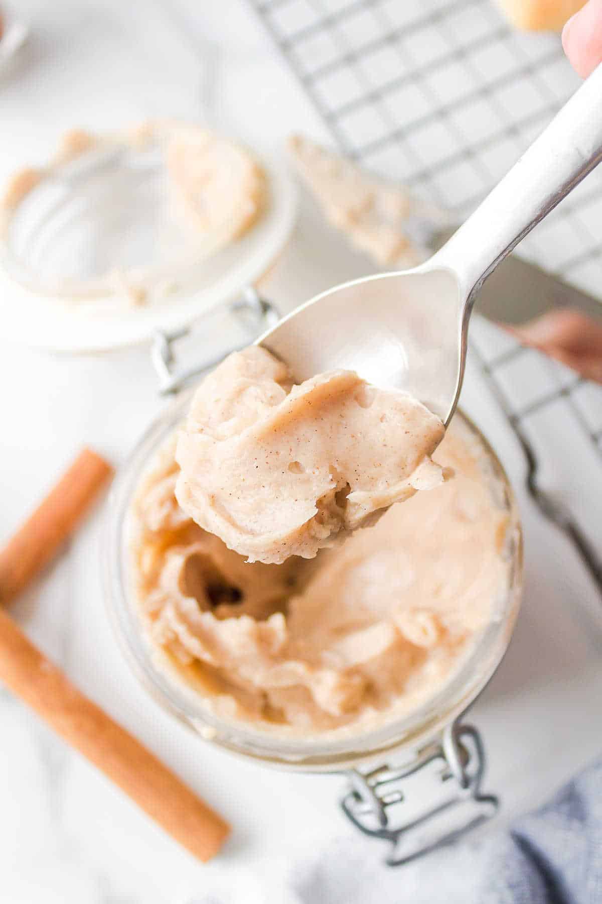 A silver spoon with a scoop of Texas Roadhouse butter on it.