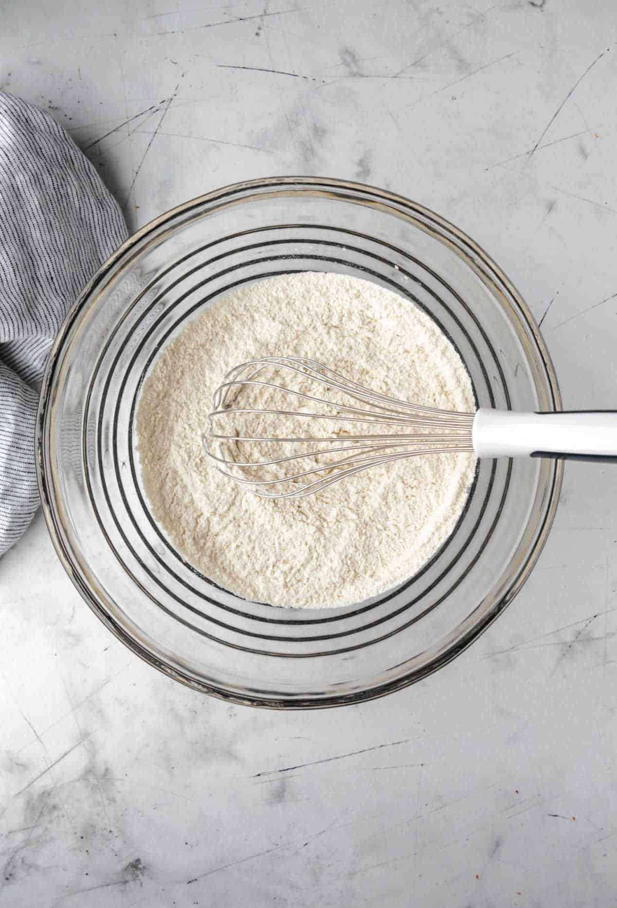 Dry ingredients in a glass mixing bowl. 