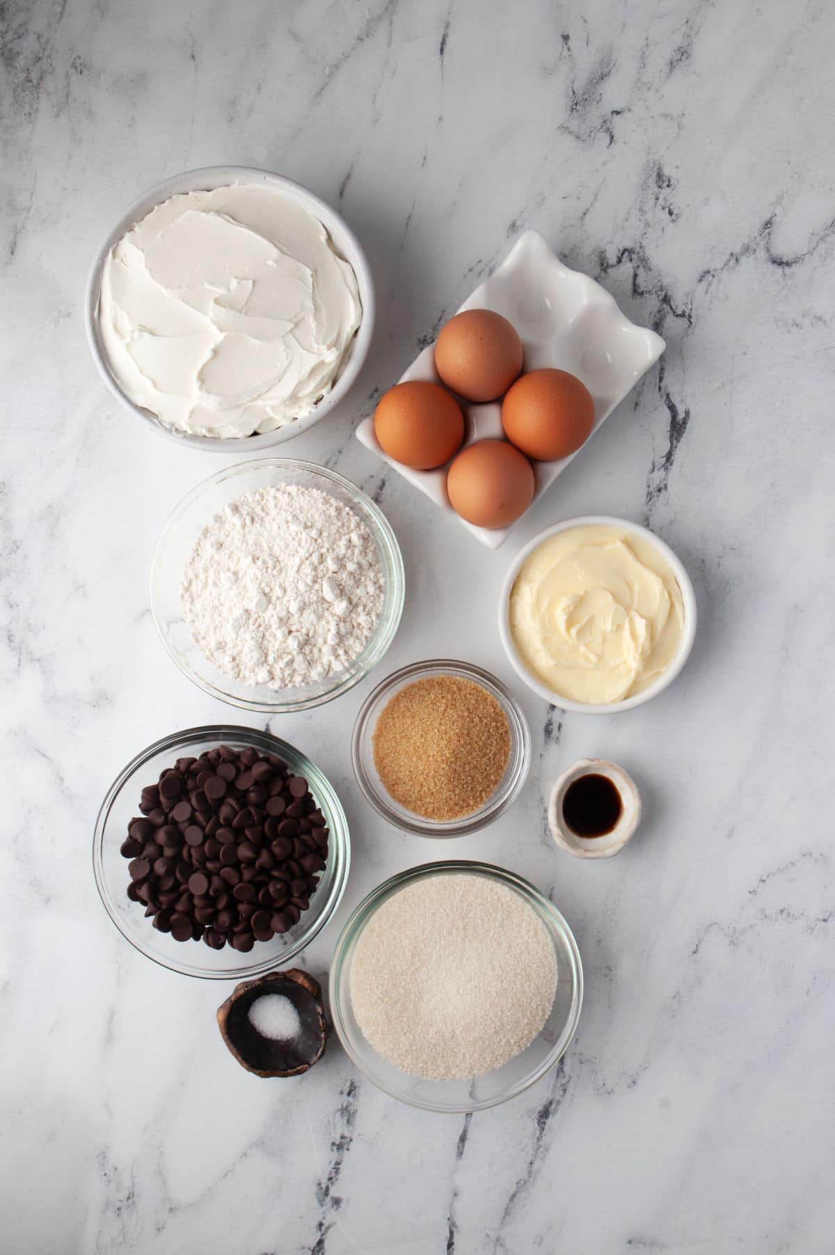 Ingredients for frozen cheesecake brownies in dishes. 