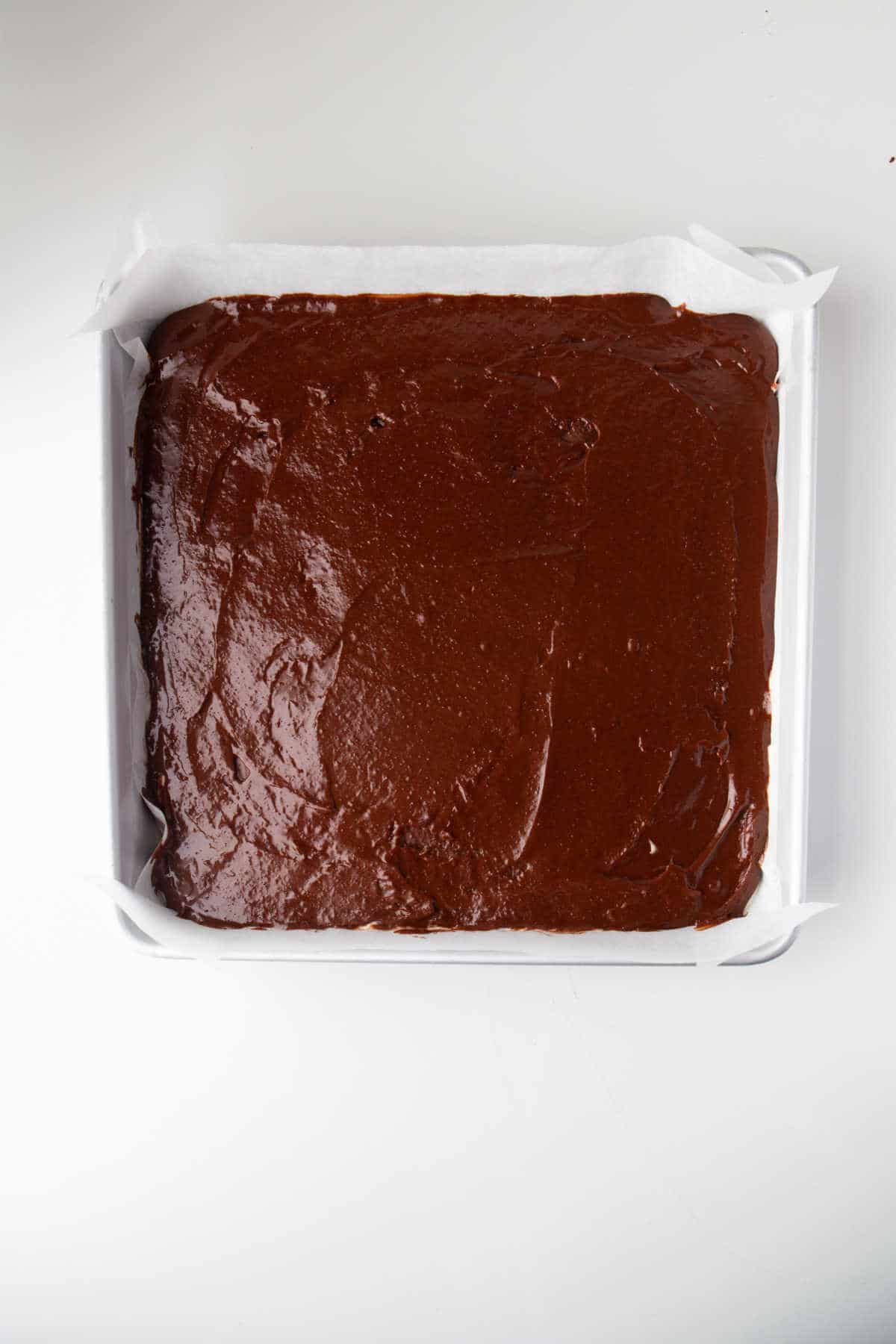 Brownie batter in a pan.