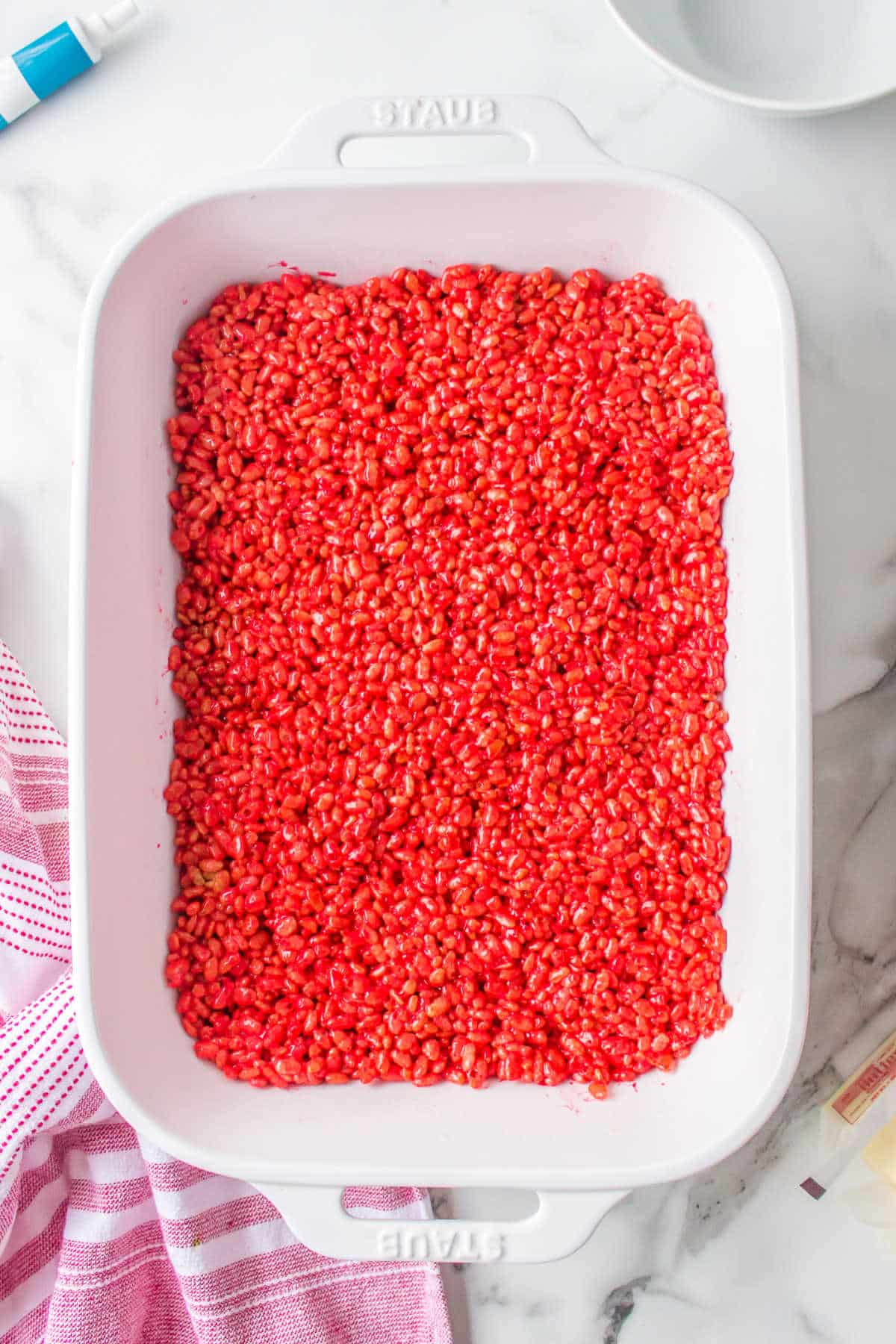 Red rice krispies treats in a pan.