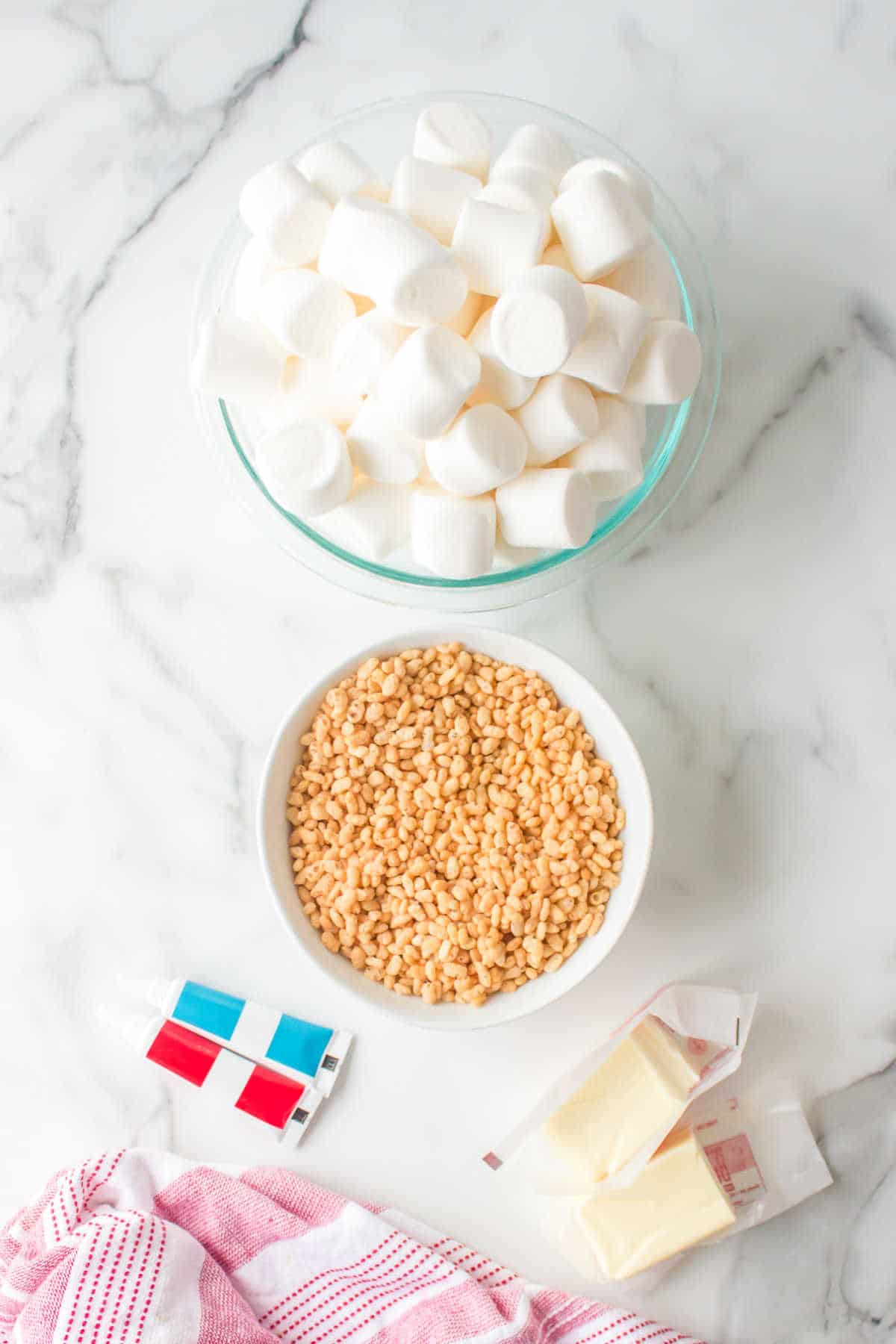 Ingredients for 4th of july rice krispies treats in dishes. 