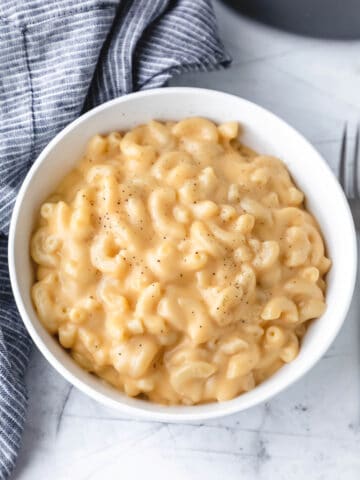A white bowl full of easy homemade mac and cheese.