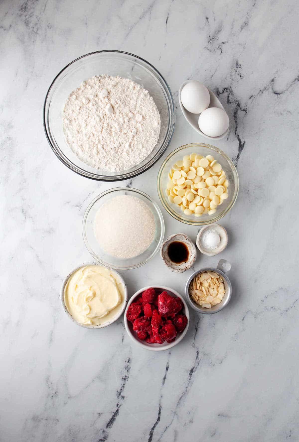 Ingredients for white chocolate raspberry blondies in dishes. 