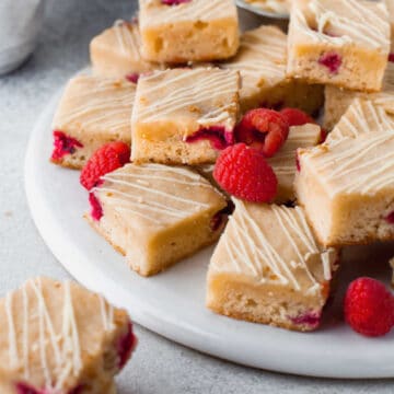 A stack of white chocolate raspberry blondies.