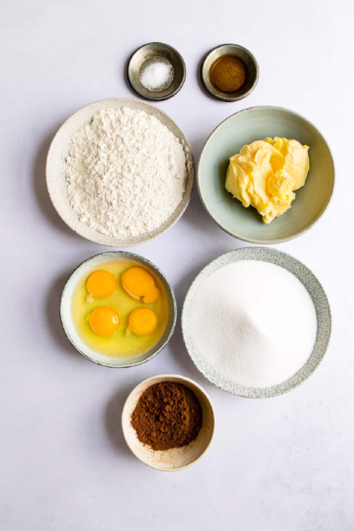 Ingredients for frosted brownies in dishes. 