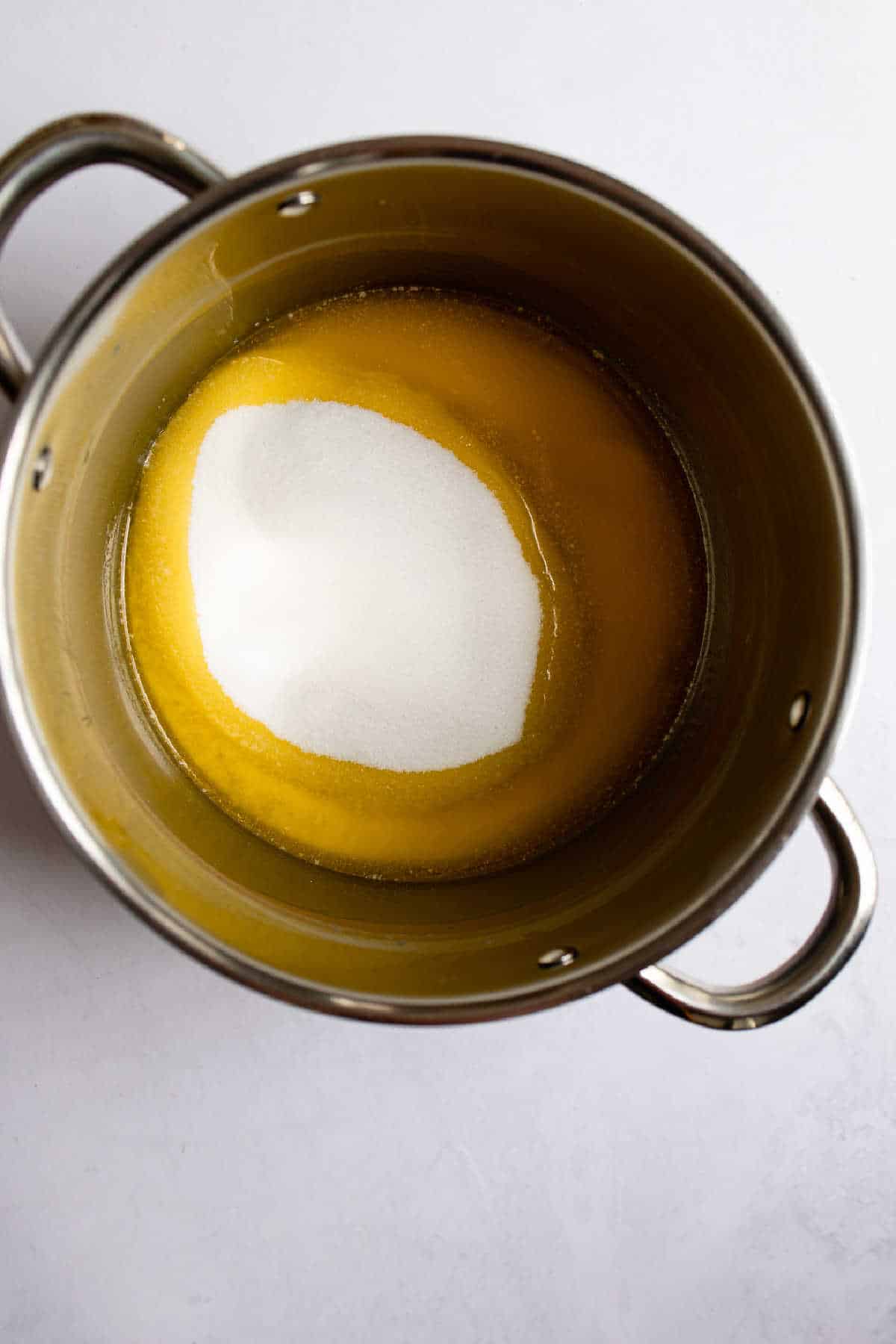 Melted butter and sugar in a saucepan.