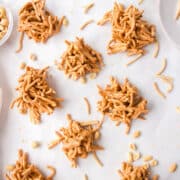 Haystack cookies on a piece of white parchment paper.