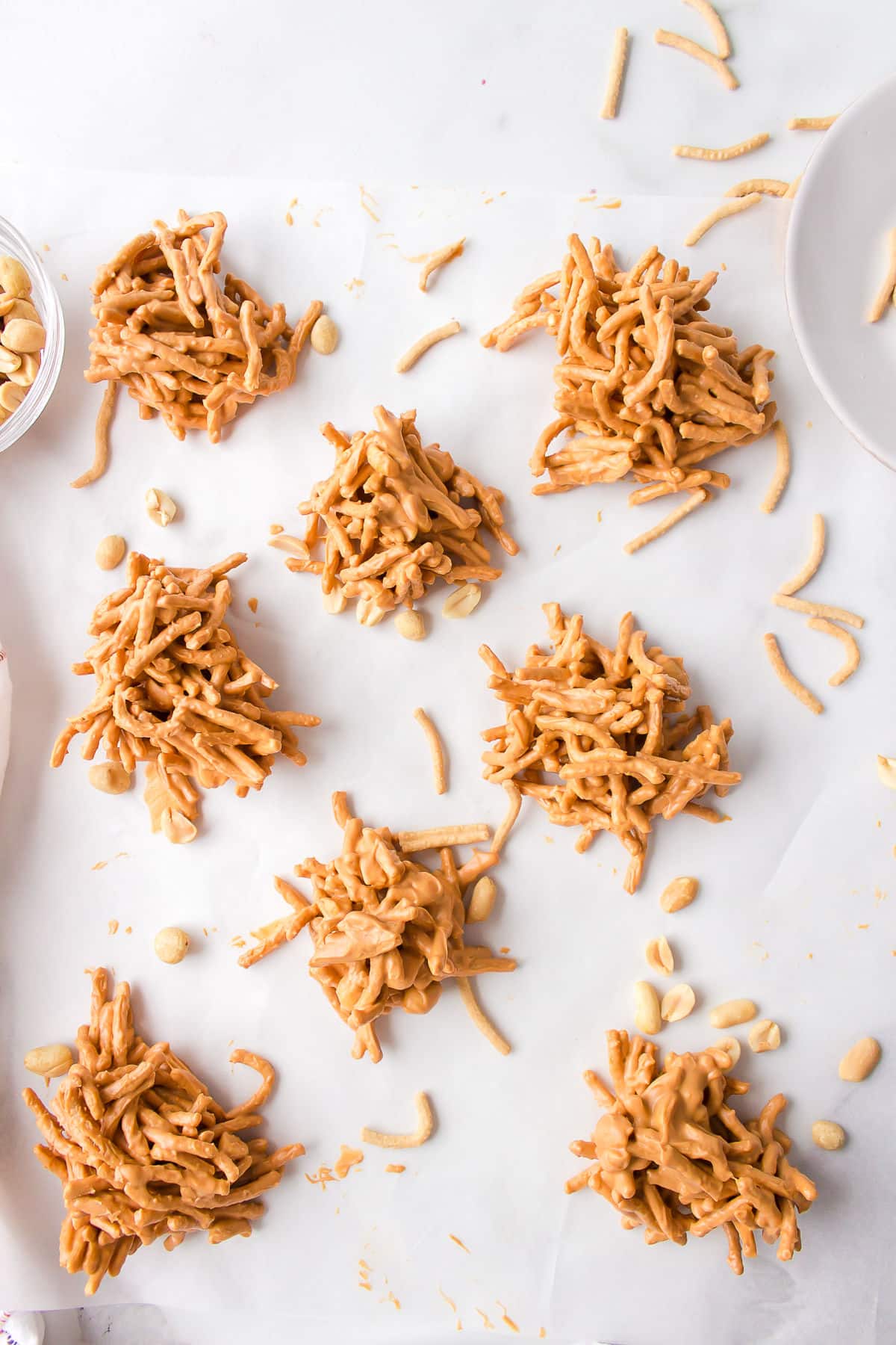 Haystack cookies on a piece of white parchment paper.