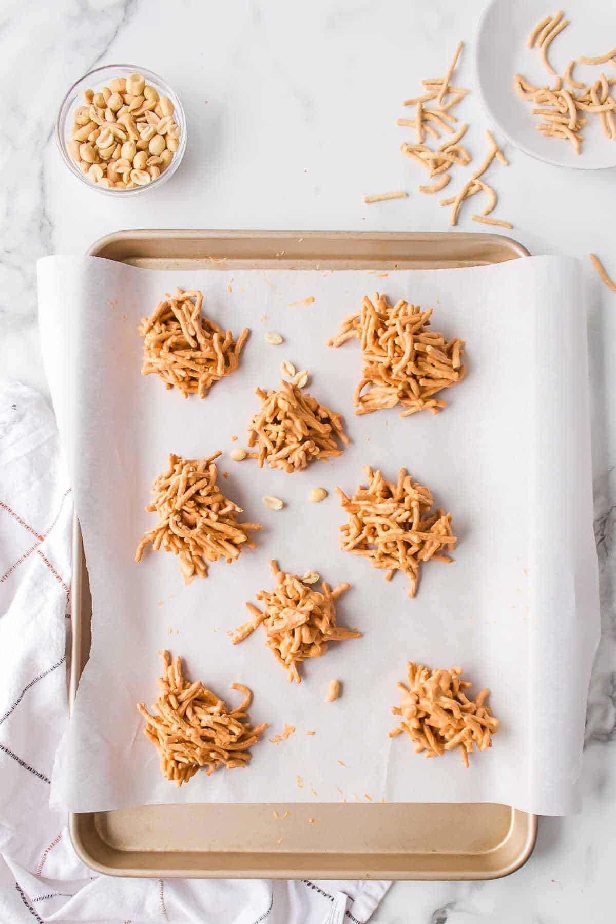 Haystack cookies on a parchment lined baking sheet. 