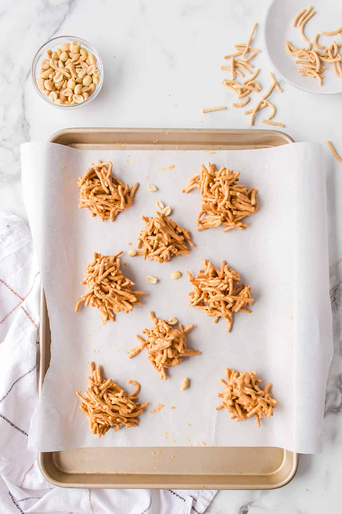 Haystack cookies on a parchment lined baking sheet.