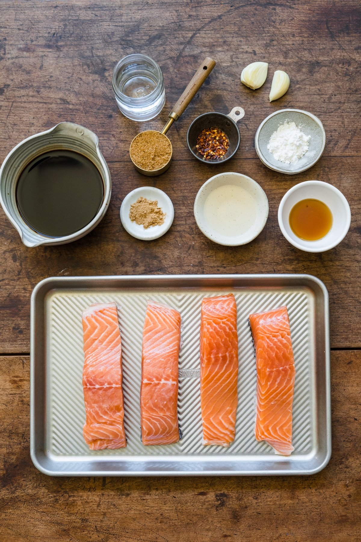 Ingredients for teriyaki salmon in dishes.