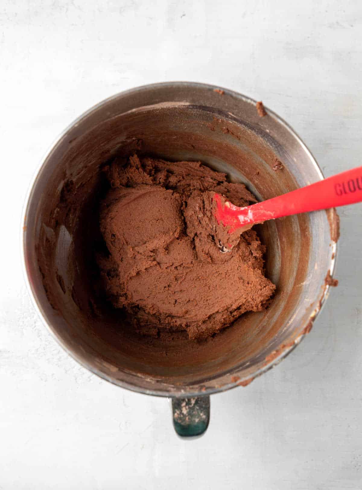 Chocolate cookie dough in a mixing bowl. 