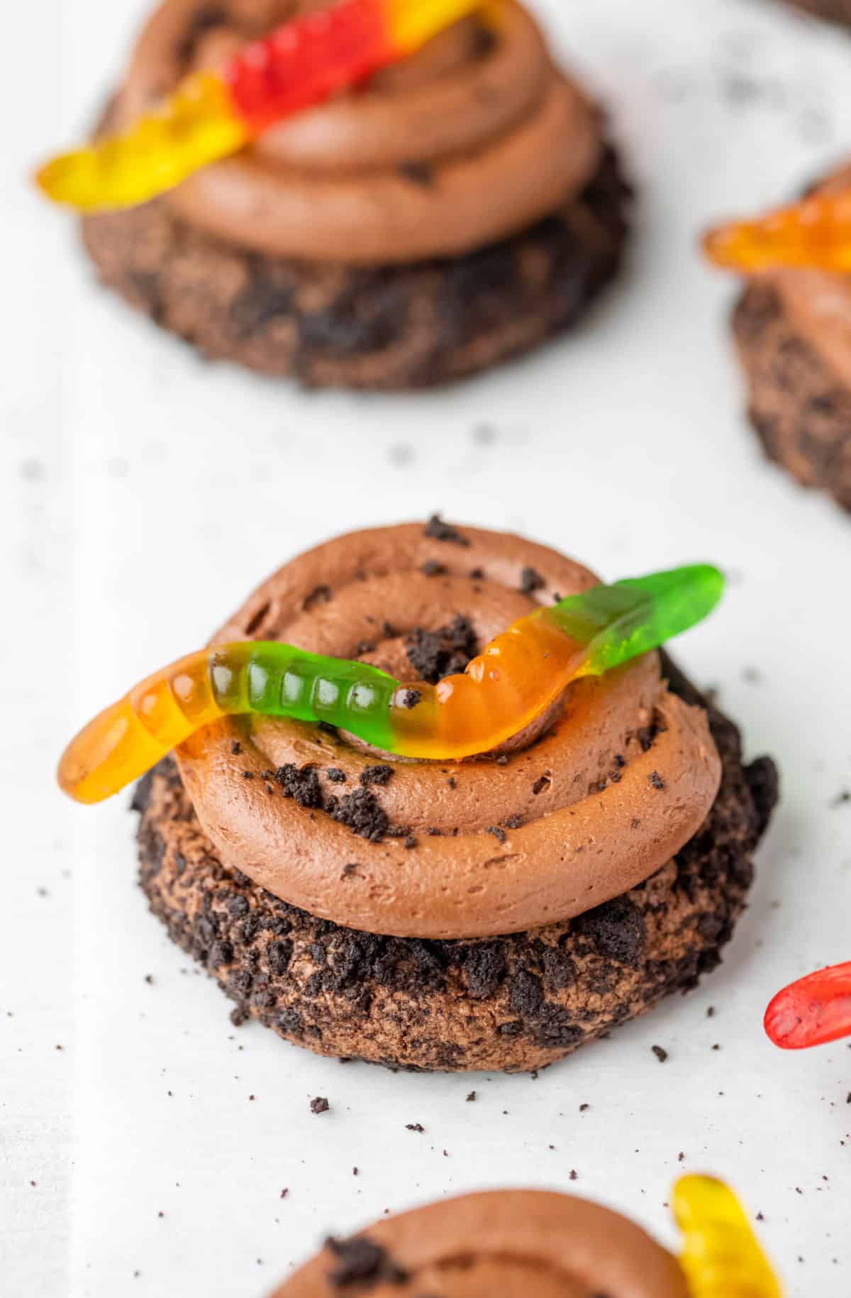 Chocolate dirt cookies in a row.