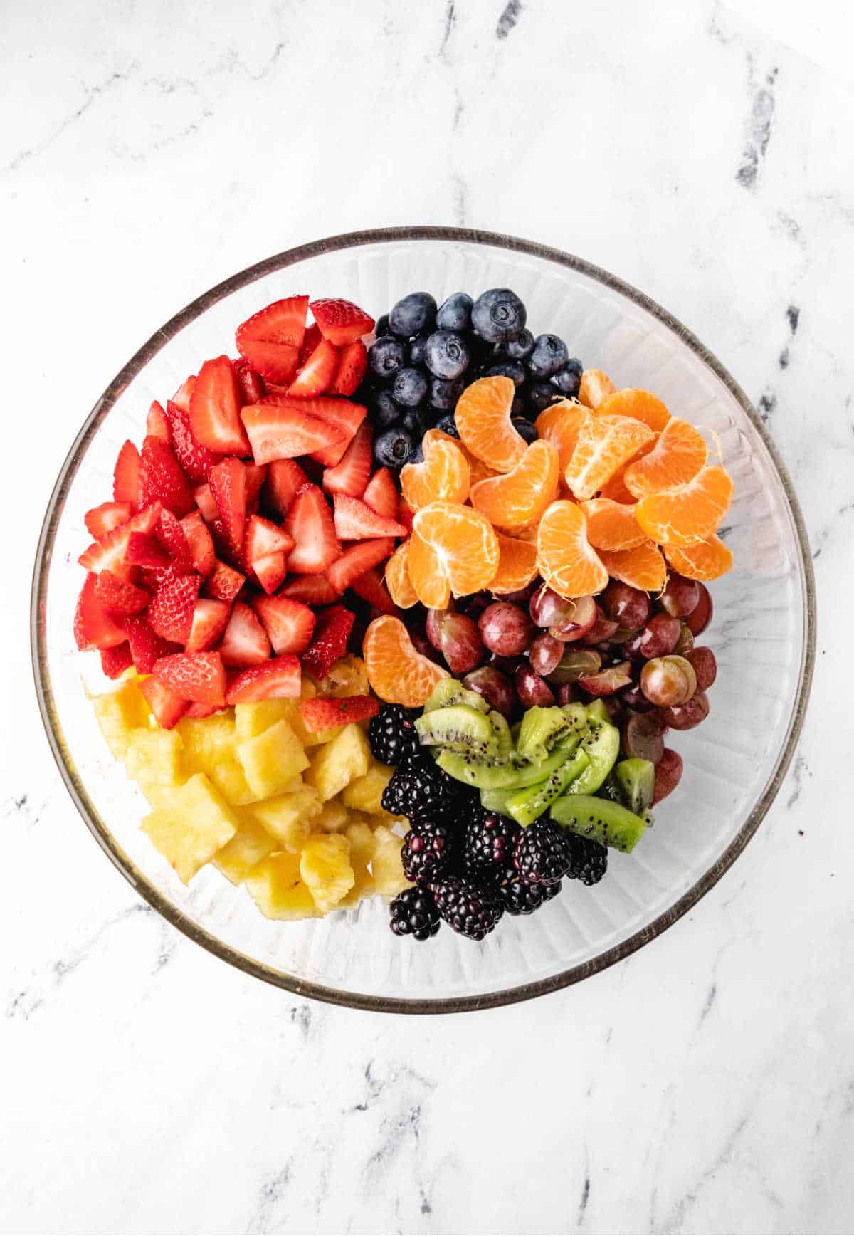 Fresh fruit in a glass mixing bowl. 