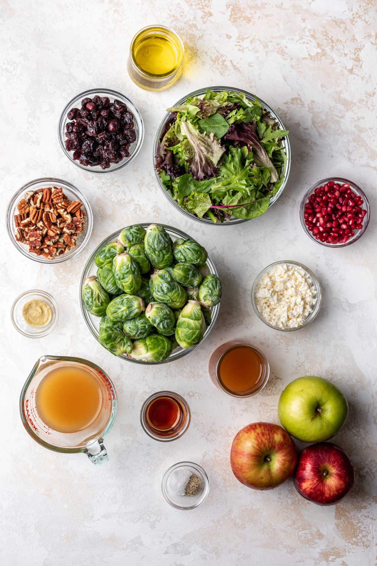 Ingredients for fall harvest salad in dishes. 