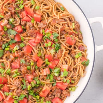 Taco spaghetti in a white skillet.