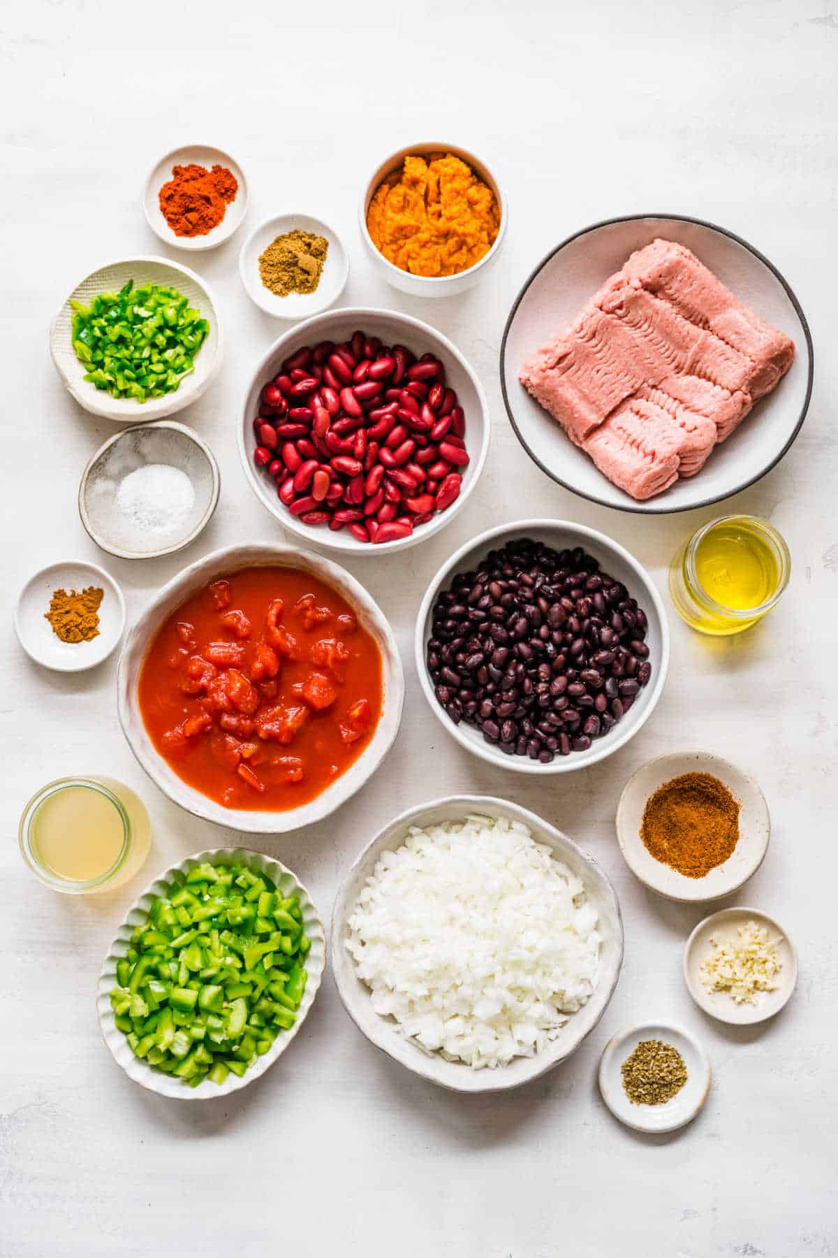 Ingredients for turkey pumpkin chili in dishes.