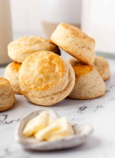 A stack of buttermilk biscuits on a marble background.