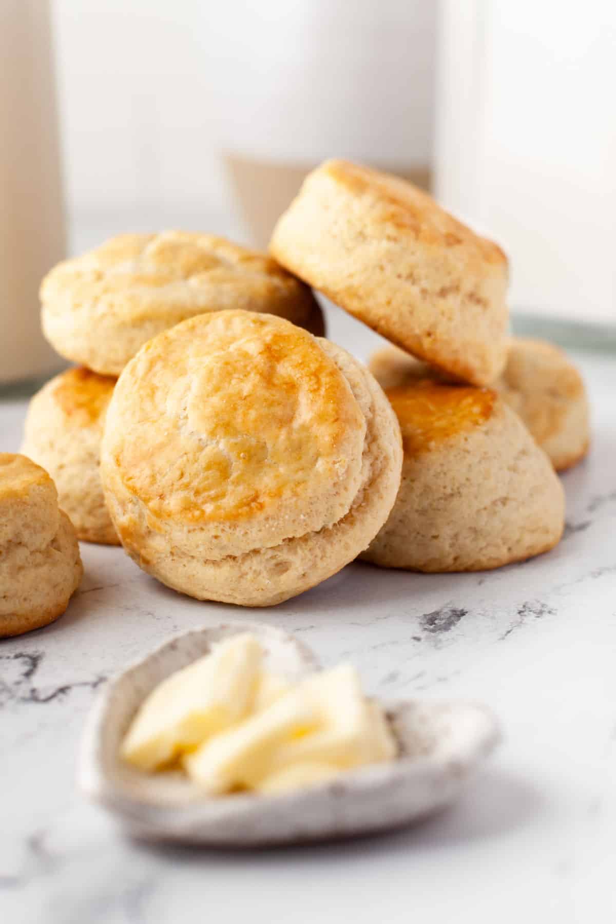 A stack of buttermilk biscuits on a marble background. 