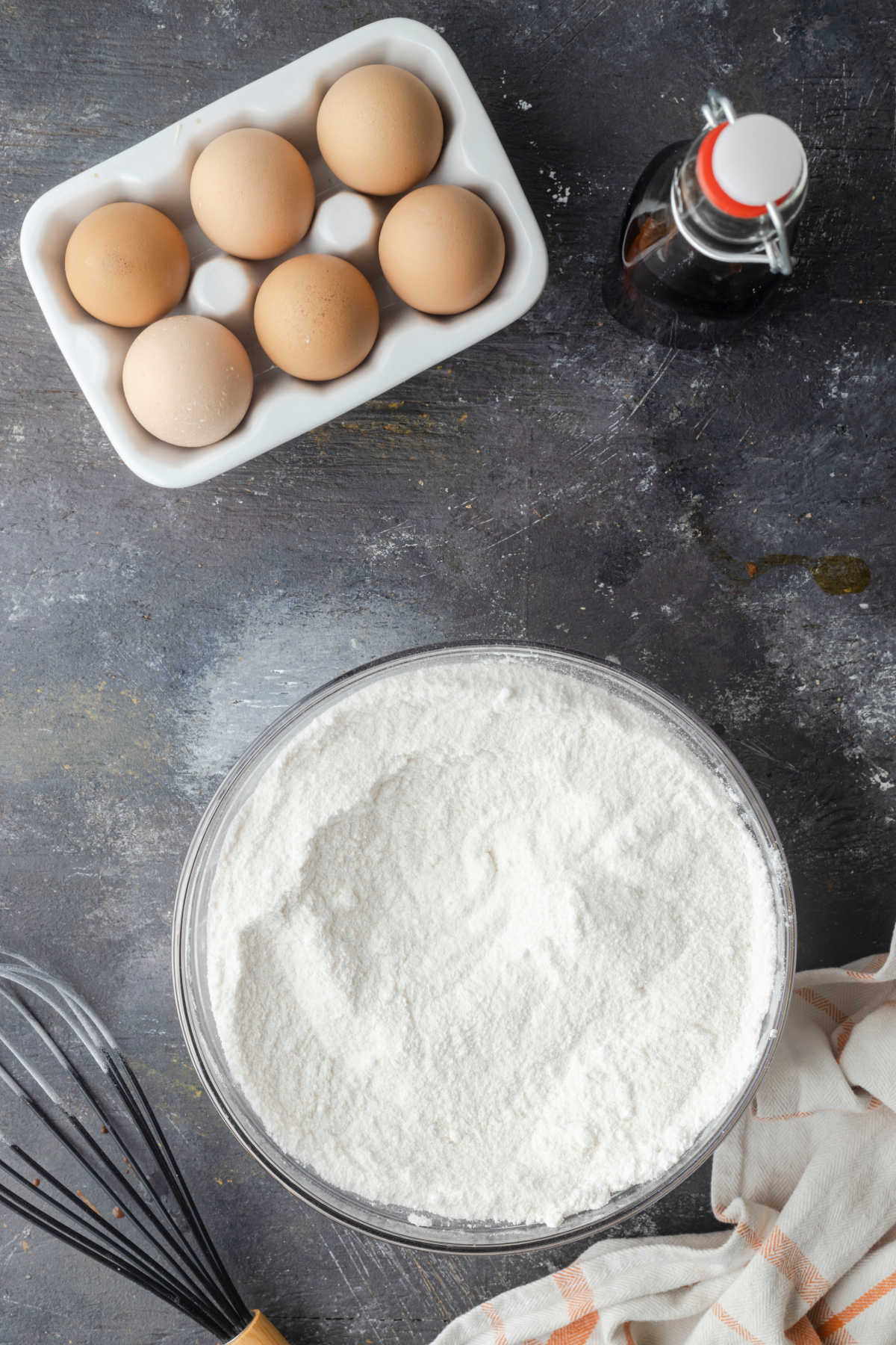 Dry ingredients whisked together in a glass mixing bowl. 