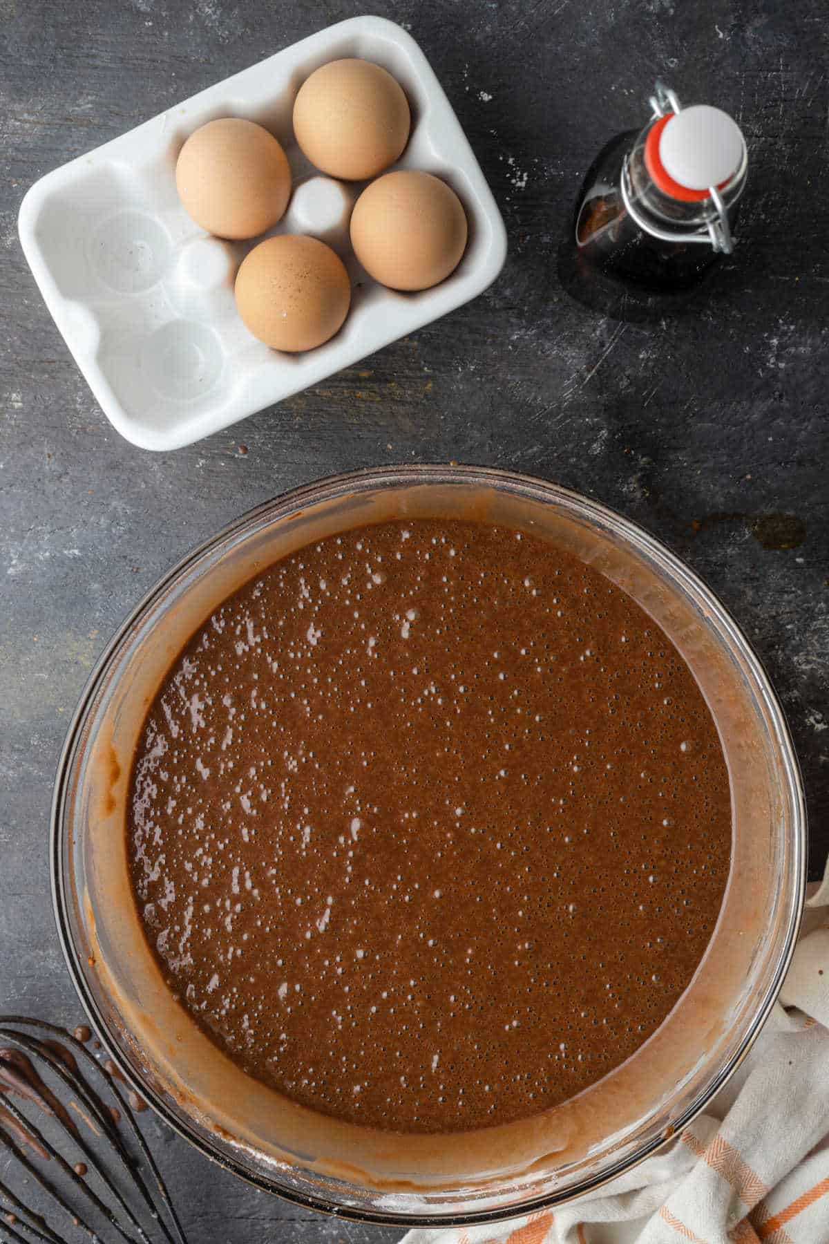 Chocolate cupcake batter in a glass mixing bowl. 