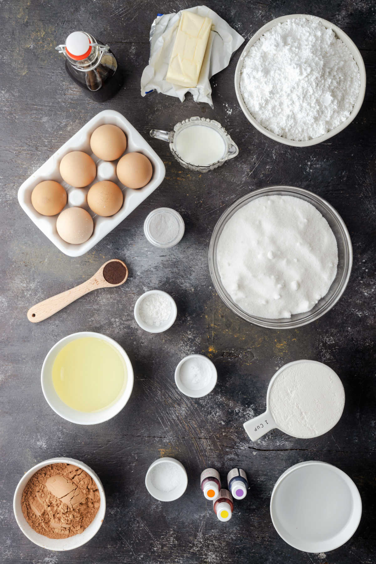 Ingredients for hocus pocus cupcakes in dishes. 