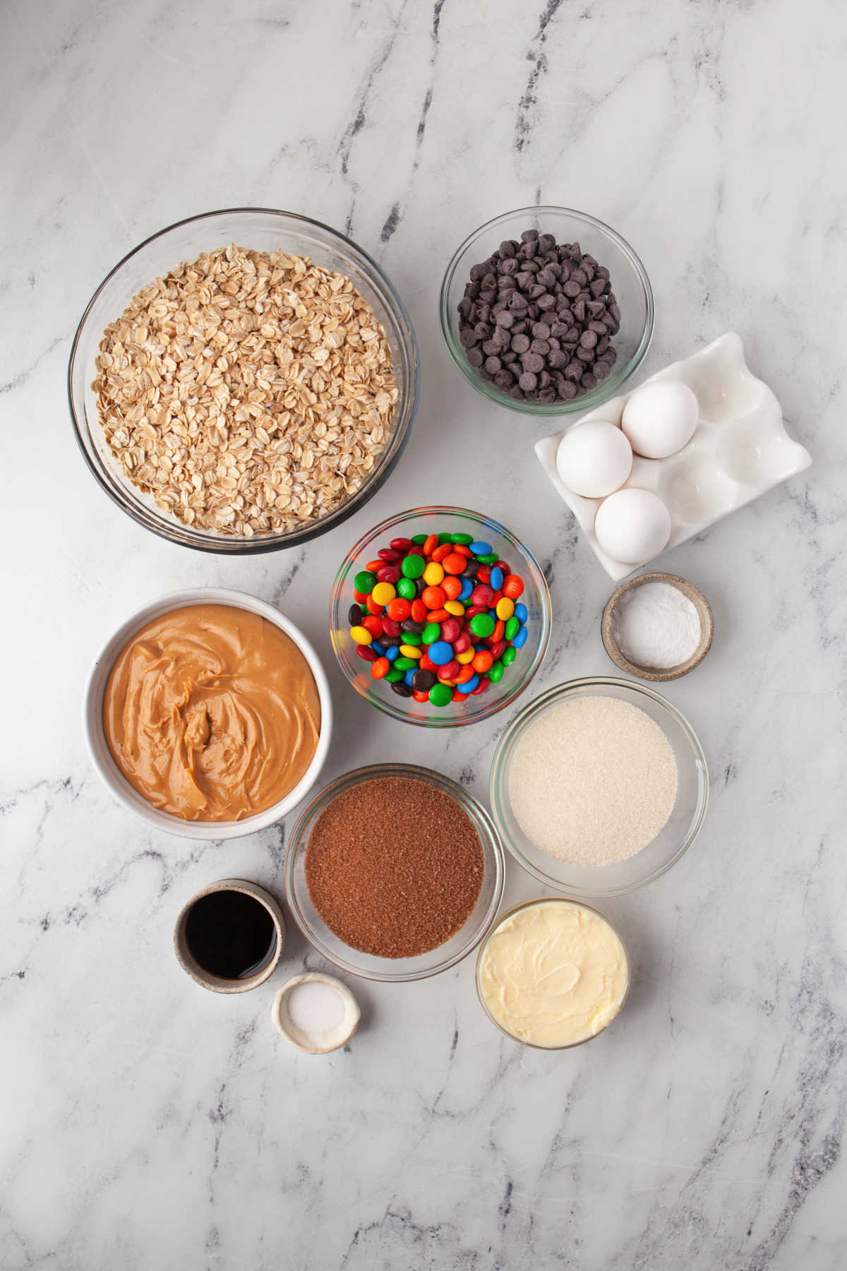 Ingredients for monster cookies in dishes.