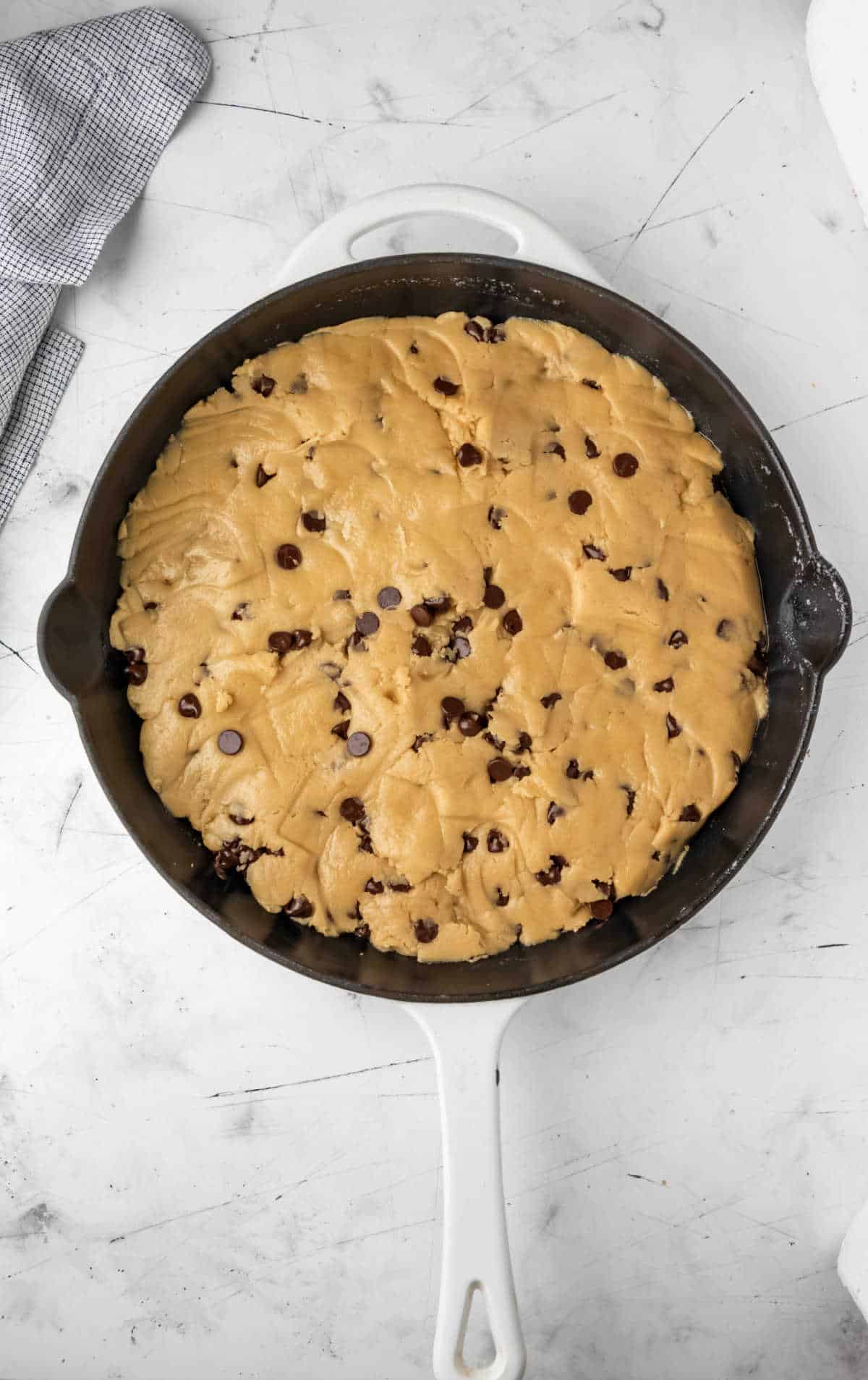 Cookie dough in a cast iron skillet. 