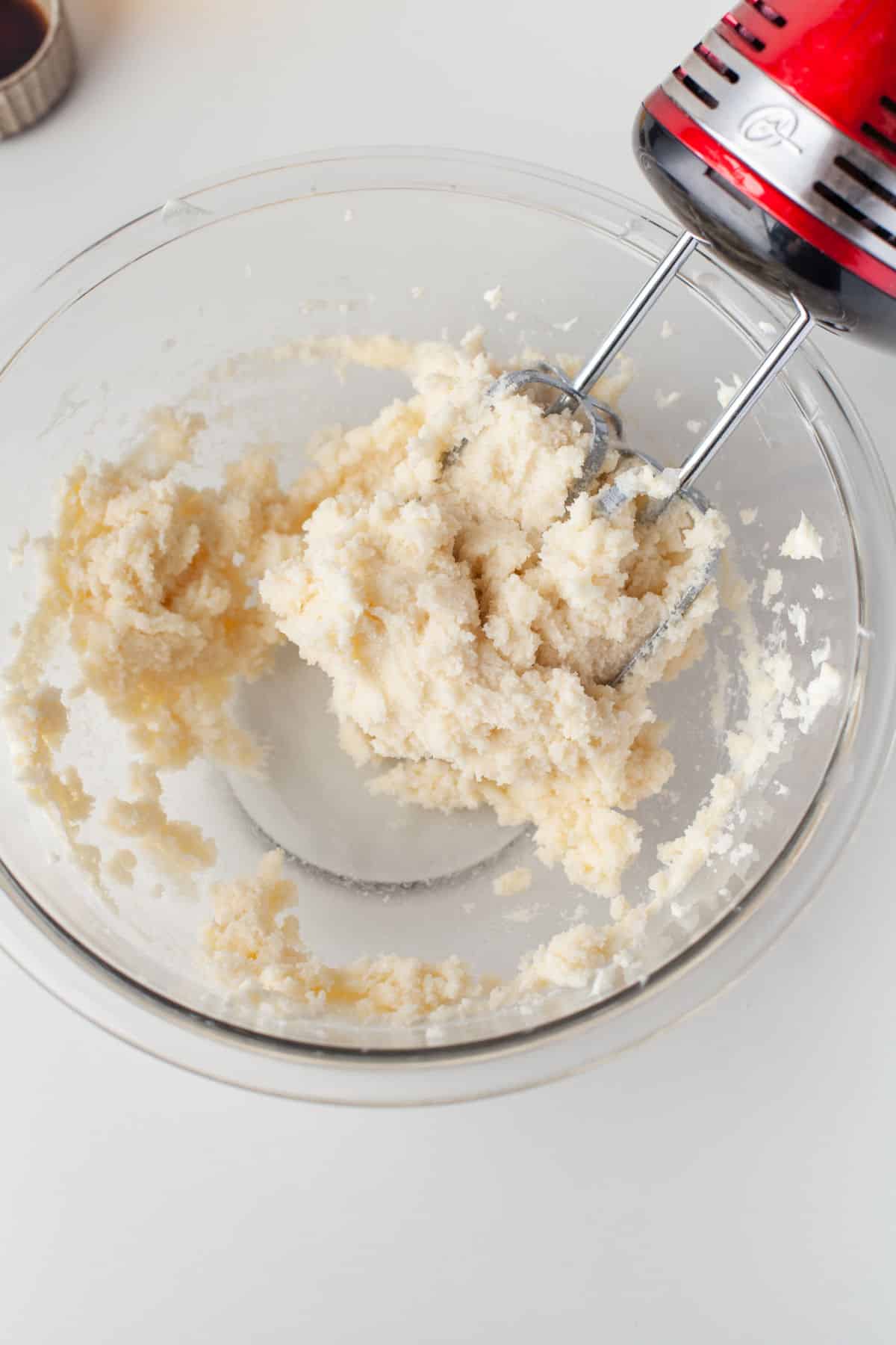Creamed butter shortening and sugar in a glass mixing bowl. 
