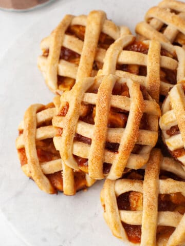 Close up photo of a stack of apple pie cookies.