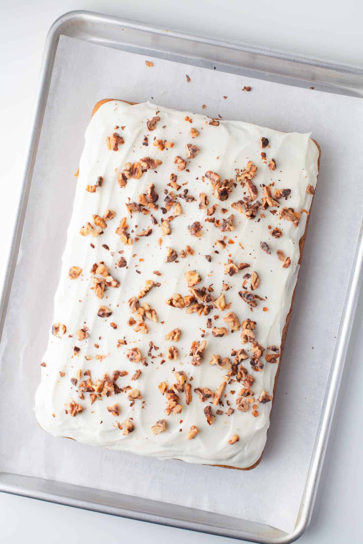 Pumpkin bars on a piece of parchment paper. 