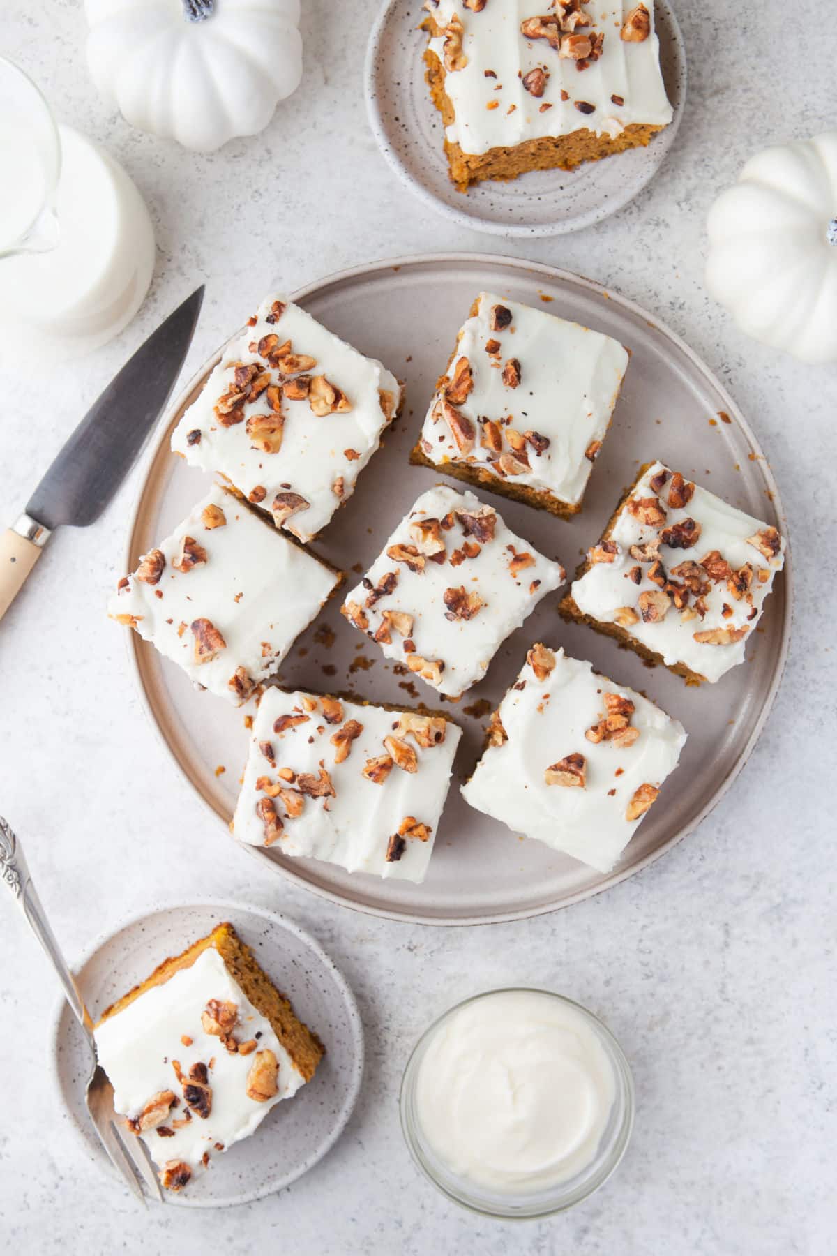 Overhead photo of pumpkin bars on a white platter. 