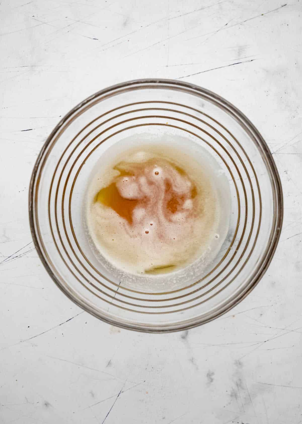 Browned butter in a glass mixing bowl. 