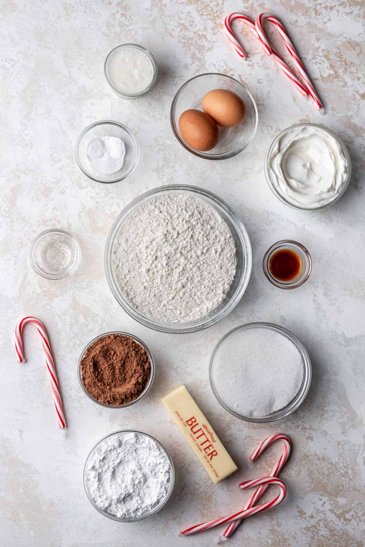 Ingredients for frosted chocolate peppermint cookies in dishes. 