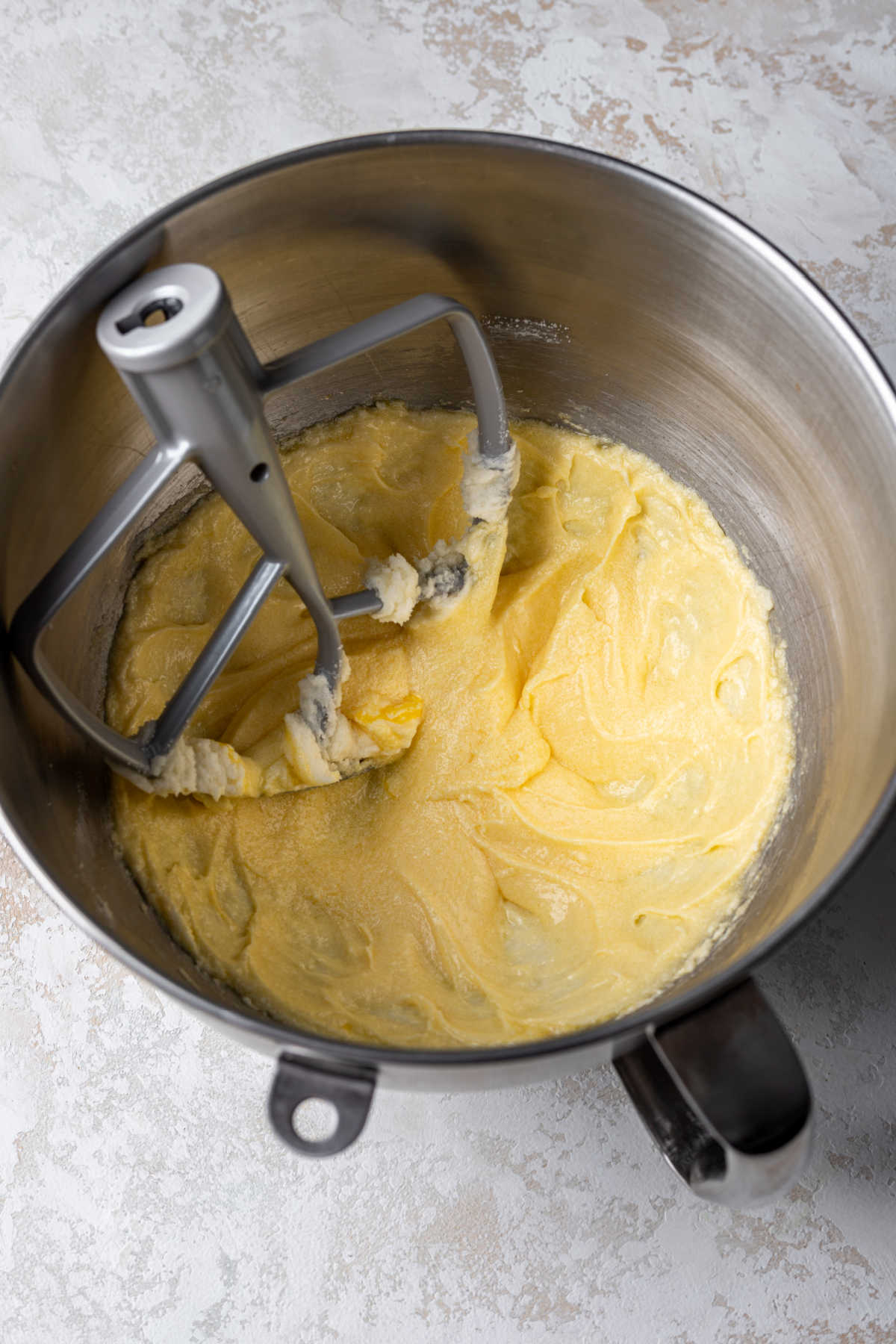 Egg and egg yolk beaten into creamed butter and sugar mixture. 