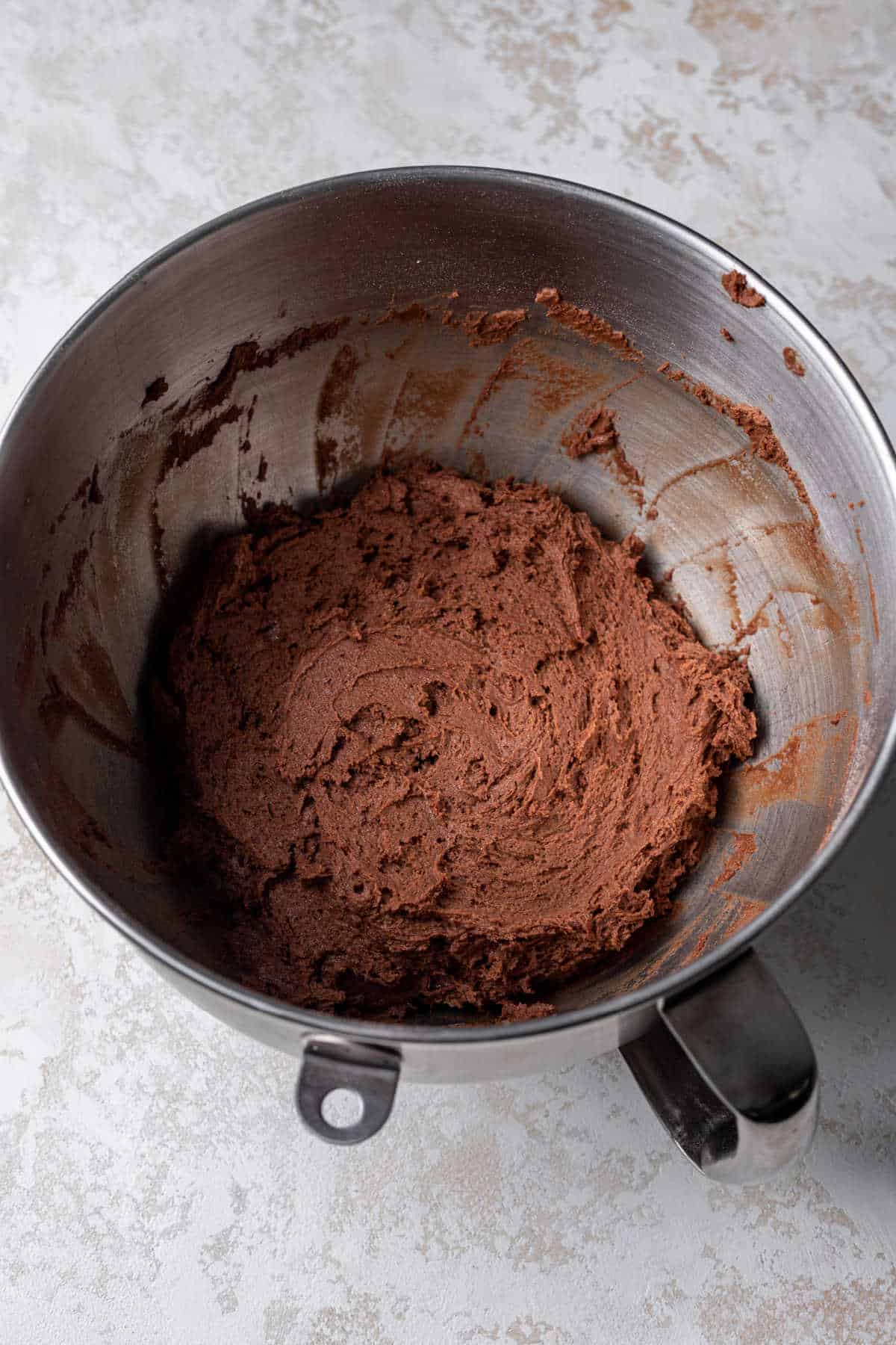 Chocolate cookie dough in a mixing bowl. 
