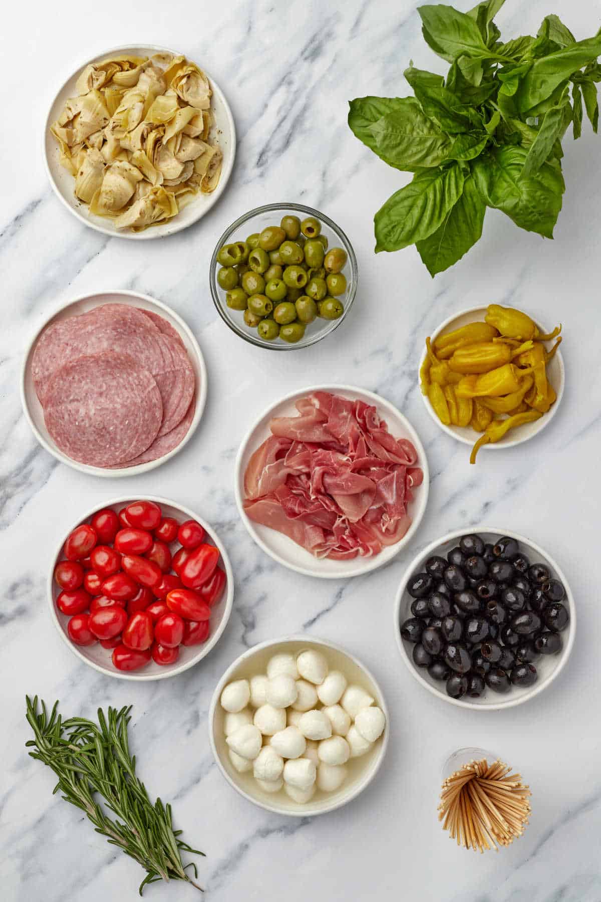 Ingredients for charcuterie wreath in dishes.