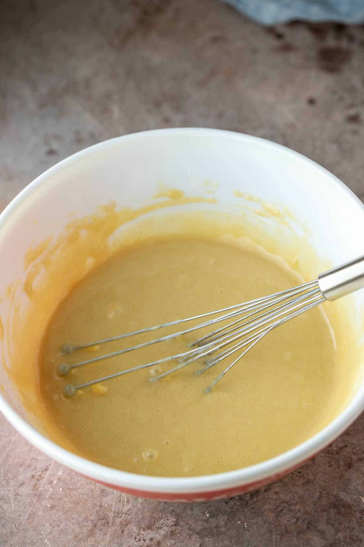 Cranberry nut bread batter in a mixing bowl. 