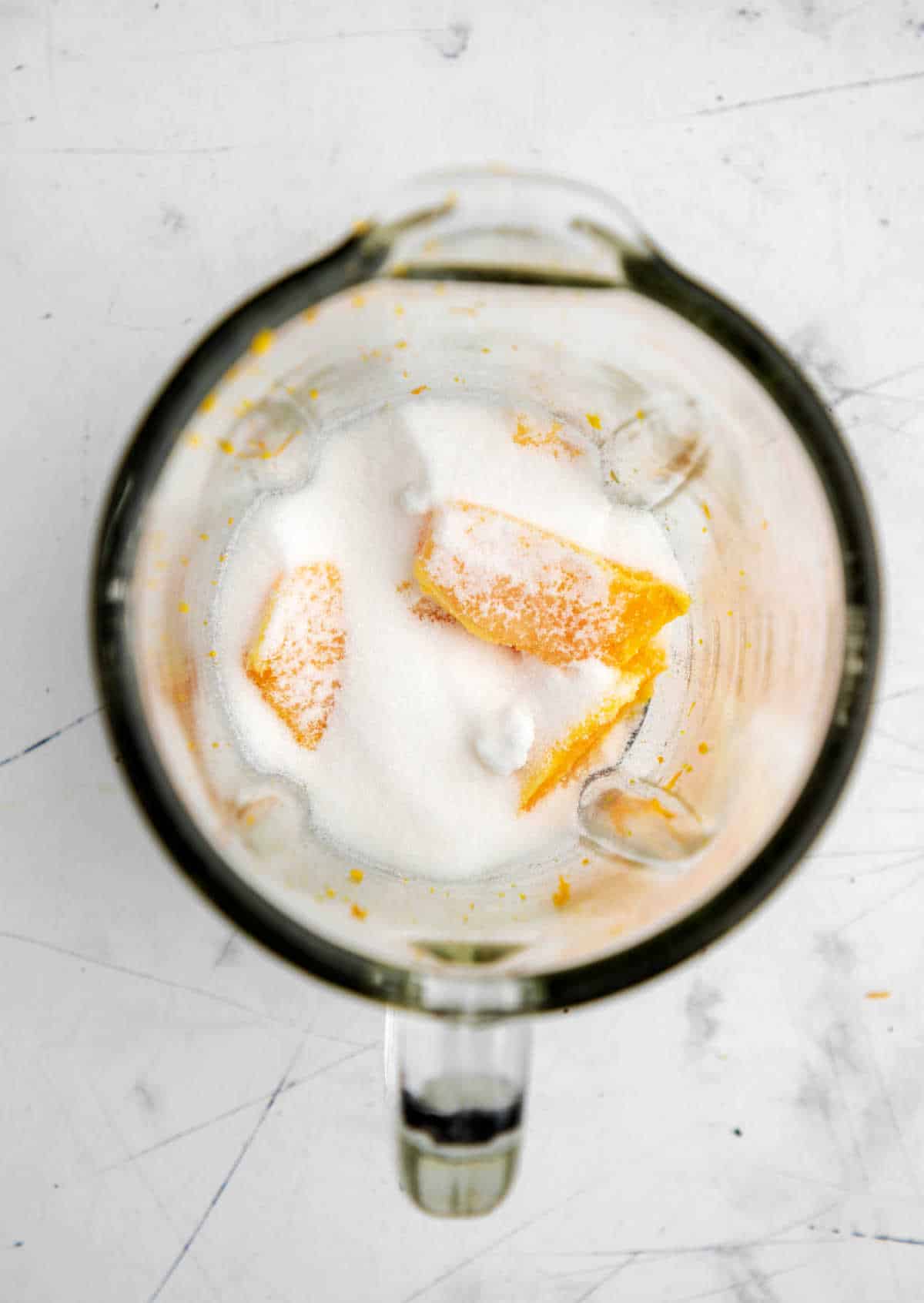 Granulated sugar on top of orange segments.