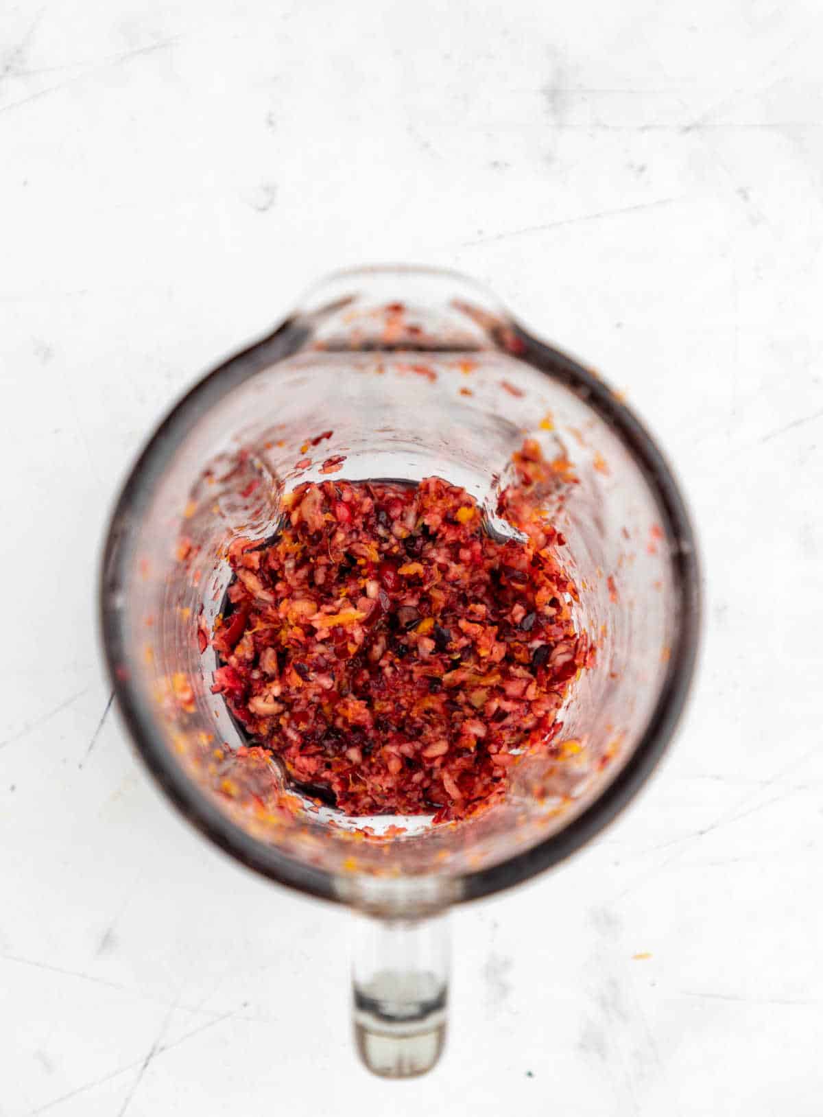 Cranberry orange relish in a blender bowl. 