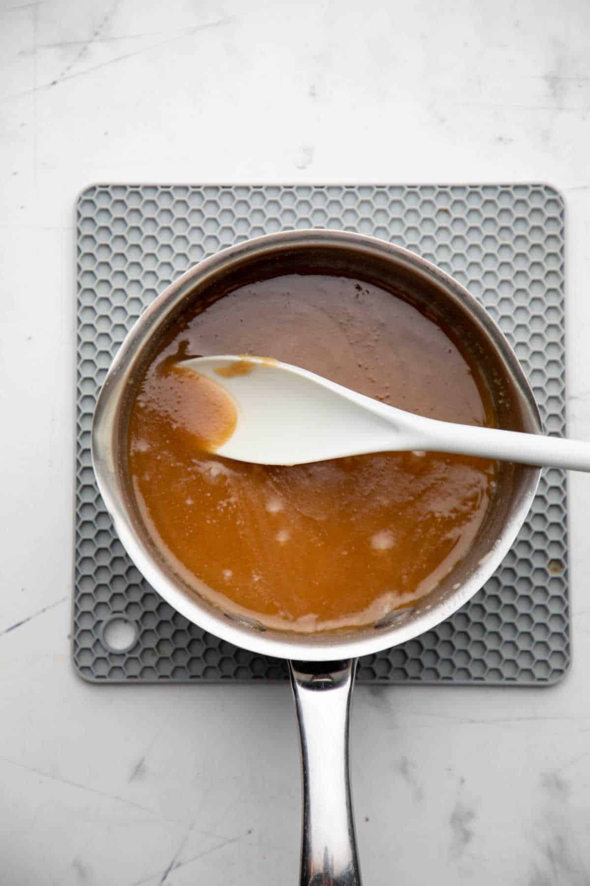 Melted butter and brown sugar in a saucepan.